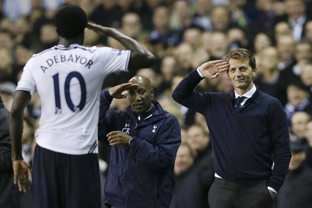 Tottenham's Emmanuel Adebayor, left, salutes to manager Tim Sherwood, right, after he scores a goal during the English Premier League soccer match between Tottenham Hotspur and Sunderland at White Hart Lane stadium in London, Monday, April 7, 2014. (AP Photo/Kirsty Wigglesworth)