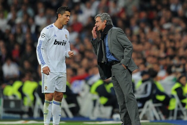 MADRID, SPAIN - OCTOBER 19:  Head Coach Jose Mourinho (R) of Real Madrid instructs Cristiano Ronaldo during the UEFA Champions League group G match between Real Madrid and AC Milan at the Estadio Santiago Bernabeu on October 19, 2010 in Madrid, Spain.  (Photo by Jasper Juinen/Getty Images)