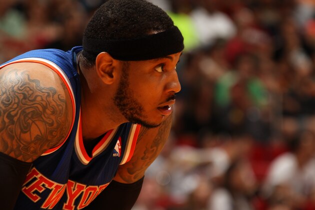 MIAMI, FL - April 6: Carmelo Anthony #7 of the New York Knicks looks on while on the court during the game against the Miami Heat at the American Airlines Arena in Miami, Florida on April 6, 2014. NOTE TO USER: User expressly acknowledges and agrees that, by downloading and/or using this photograph, user is consenting to the terms and conditions of the Getty Images License Agreement. Mandatory copyright notice: Copyright NBAE 2014 (Photo by Issac Baldizon/NBAE via Getty Images)