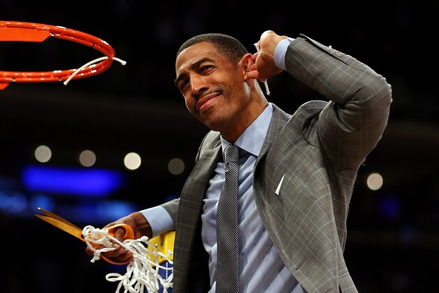 NEW YORK, NY - MARCH 30: Head coach Kevin Ollie of the Connecticut Huskies cuts down the net after defeating the Michigan State Spartans to win the East Regional Final of the 2014 NCAA Men's Basketball Tournament at Madison Square Garden on March 30, 2014 in New York City. (Photo by Elsa/Getty Images) NEW YORK, NY - MARCH 30: Head coach Kevin Ollie of the Connecticut Huskies cuts down the net after defeating the Michigan State Spartans to win the East Regional Final of the 2014 NCAA Men's Basketball Tournament at Madison Square Garden on March 30, 2014 in New York City. (Photo by Elsa/Getty Images)