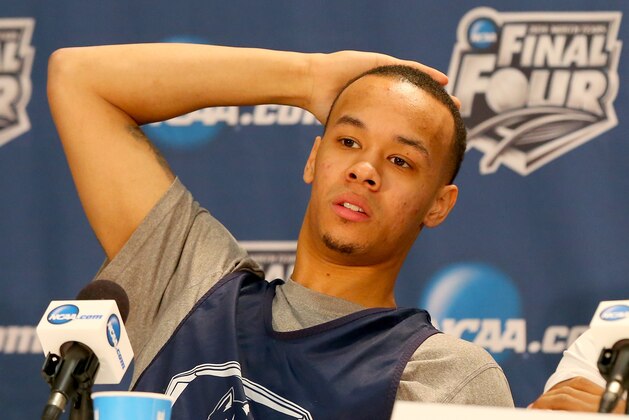 ARLINGTON, TX - APRIL 04:  Shabazz Napier #13 of the Connecticut Huskies answers questions from the media before practice ahead of the 2014 NCAA Men's Final Four at AT&T Stadium on April 4, 2014 in Arlington, Texas.  (Photo by Ronald Martinez/Getty Images)
