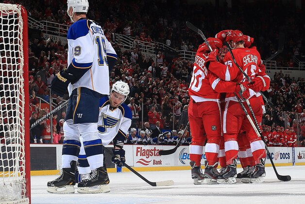 DETROIT, MI - JANUARY 20: Henrik Zetterberg #40, Tomas Tatar #21, Riley Sheahan #15 and Niklas Kronwall #55 of the Detroit Red Wings congratulate teammate Gustav Nyquist #14 after scoring a goal as Jay Bouwmeester #19 and Vladimir Sobotka #17 of the St. Louis Blues can only watch during an NHL game on January 20, 2014 at Joe Louis Arena in Detroit, Michigan. (Photo by Dave Reginek/NHLI via Getty Images) DETROIT, MI - JANUARY 20: Henrik Zetterberg #40, Tomas Tatar #21, Riley Sheahan #15 and Niklas Kronwall #55 of the Detroit Red Wings congratulate teammate Gustav Nyquist #14 after scoring a goal as Jay Bouwmeester #19 and Vladimir Sobotka #17 of the St. Louis Blues can only watch during an NHL game on January 20, 2014 at Joe Louis Arena in Detroit, Michigan. (Photo by Dave Reginek/NHLI via Getty Images)