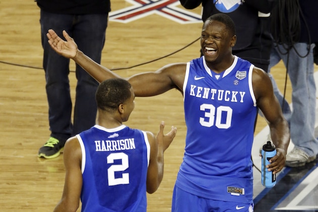 After Kentucky guard Aaron Harrison (2) made a three-point basket in the final seconds against Wisconsin to win the game 74-73, he celebrates with Julius Randle (30) at the end of their NCAA Final Four tournament college basketball semifinal game Saturday, April 5, 2014, in Arlington, Texas. (AP Photo/Tony Gutierrez)