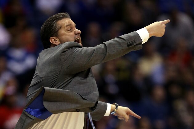 INDIANAPOLIS, IN - MARCH 28:  Head coach John Calipari of the Kentucky Wildcats shouts to his team against the Louisville Cardinals during the regional semifinal of the 2014 NCAA Men's Basketball Tournament at Lucas Oil Stadium on March 28, 2014 in Indianapolis, Indiana.  (Photo by Jonathan Daniel/Getty Images)