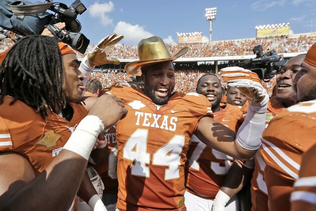 Texas defensive end Jackson Jeffcoat (44) celebrates with teammates after an NCAA college football game at the Cotton Bowl Saturday, Oct. 12, 2013, in Dallas. (AP Photo/LM Otero) Texas defensive end Jackson Jeffcoat (44) celebrates with teammates after an NCAA college football game at the Cotton Bowl Saturday, Oct. 12, 2013, in Dallas. (AP Photo/LM Otero)
