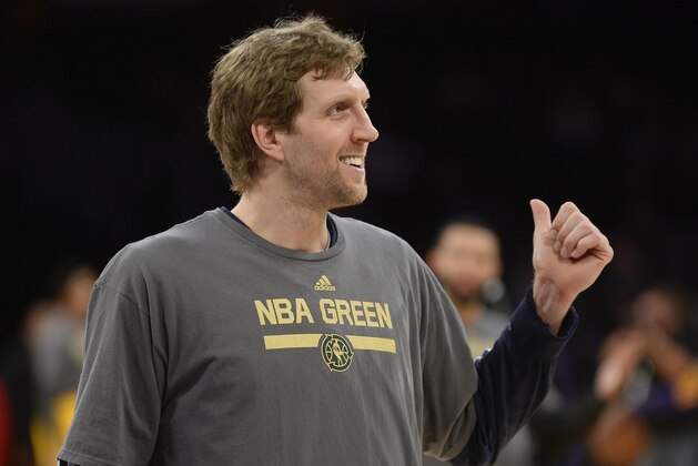 Dallas Mavericks forward Dirk Nowitzki (41), of Germany, warms up for the start of an NBA basketball game against the Los Angeles Lakers, Friday, April 4, 2014, in Los Angeles.(AP Photo/Gus Ruelas)