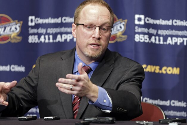 Cleveland Cavaliers acting general manager David Griffin talks to reporters before an NBA basketball game between the Memphis Grizzlies and Cavaliers, Sunday, Feb. 9, 2014, in Cleveland. Griffin takes over for Chris Grant who was fired last Thursday. (AP Photo/Mark Duncan)