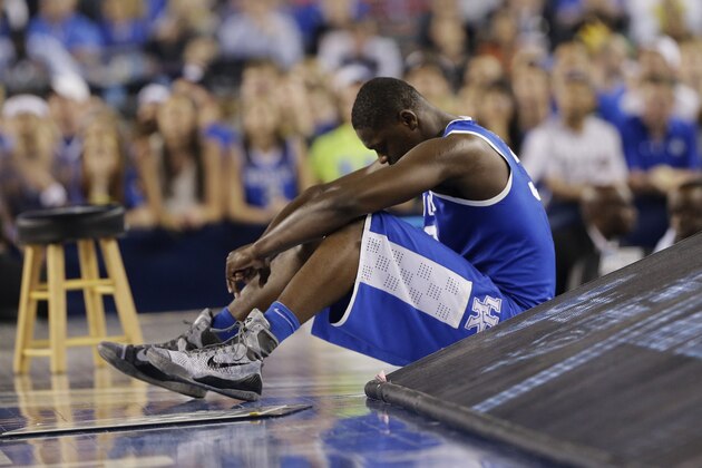 Kentucky forward Julius Randle sits on the sideline during the second half of the NCAA Final Four tournament college basketball championship game against Connecticut Monday, April 7, 2014, in Arlington, Texas. (AP Photo/Eric Gay)