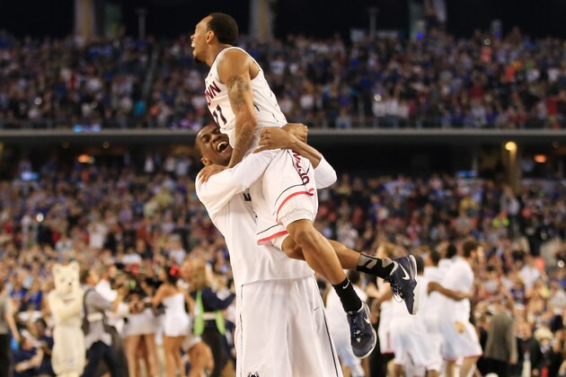 ARLINGTON, TX - APRIL 07:  Ryan Boatright #11 of the Connecticut Huskies celebrates with a teammate after defeating the Kentucky Wildcats 60-54 in the NCAA Men's Final Four Championship at AT&T Stadium on April 7, 2014 in Arlington, Texas.  (Photo by Jamie Squire/Getty Images)
