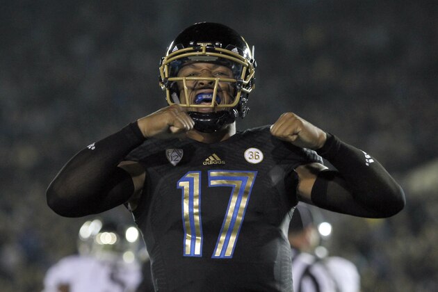 UCLA quarterback Brett Hundley, celebrates a touchdown in the first half of their NCAA college football game against Washington, Friday, Nov. 15, 2013, in Pasadena, Calif.  (AP Photo/Alex Gallardo)