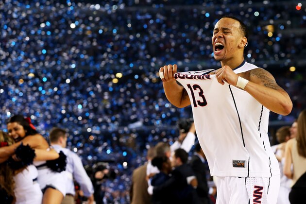 ARLINGTON, TX - APRIL 07:  Shabazz Napier #13 of the Connecticut Huskies celebrates on the court after defeating the Kentucky Wildcats 60-54 in the NCAA Men's Final Four Championship at AT&T Stadium on April 7, 2014 in Arlington, Texas.  (Photo by Ronald Martinez/Getty Images)