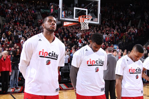 PORTLAND, OR - MARCH 30:  LaMarcus Aldridge #12, Thomas Robinson #41 and Damian Lillard #0 of the Portland Trail Blazers stand on the court before the game against the Memphis Grizzlies on March 30, 2014 at the Moda Center Arena in Portland, Oregon. NOTE TO USER: User expressly acknowledges and agrees that, by downloading and or using this photograph, user is consenting to the terms and conditions of the Getty Images License Agreement. Mandatory Copyright Notice: Copyright 2014 NBAE (Photo by Sam Forencich/NBAE via Getty Images)
