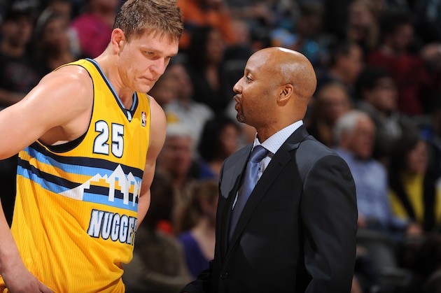 DENVER, CO - MARCH 5: Brian Shaw of the Denver Nuggets talks with Timofey Mozgov #25 during the game against the Dallas Mavericks on March 5, 2014 at the Pepsi Center in Denver, Colorado. NOTE TO USER: User expressly acknowledges and agrees that, by downloading and/or using this Photograph, user is consenting to the terms and conditions of the Getty Images License Agreement. Mandatory Copyright Notice: Copyright 2014 NBAE (Photo by Garrett W. Ellwood/NBAE via Getty Images)