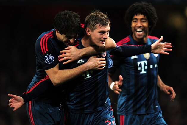 LONDON, ENGLAND - FEBRUARY 19: Toni Kroos of Bayern Muenchen celebrates scoring the opening goal with Javi Martinez of Bayern Muenchen during the UEFA Champions League Round of 16 first leg match between Arsenal and FC Bayern Muenchen at Emirates Stadium on February 19, 2014 in London, England. (Photo by Shaun Botterill/Getty Images) LONDON, ENGLAND - FEBRUARY 19: Toni Kroos of Bayern Muenchen celebrates scoring the opening goal with Javi Martinez of Bayern Muenchen during the UEFA Champions League Round of 16 first leg match between Arsenal and FC Bayern Muenchen at Emirates Stadium on February 19, 2014 in London, England. (Photo by Shaun Botterill/Getty Images)
