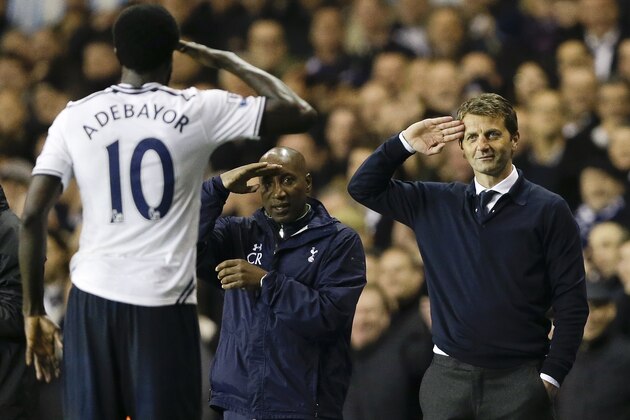 Tottenham's Emmanuel Adebayor, left, salutes to manager Tim Sherwood, right, after he scores a goal during the English Premier League soccer match between Tottenham Hotspur and Sunderland at White Hart Lane stadium in London, Monday, April 7, 2014. (AP Photo/Kirsty Wigglesworth)