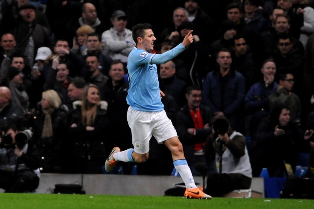 Manchester City's Stevan Jovetic celebrates after scoring against Chelsea  during their English FA Cup fifth round  soccer match between Manchester City and Chelsea at The Etihad Stadium, Manchester, England, Saturday, Feb. 15, 2014. (AP Photo/Rui Vieira)
