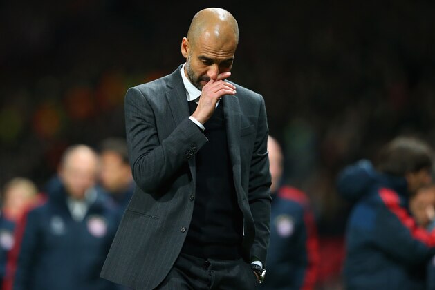 MANCHESTER, ENGLAND - APRIL 01:  Pep Guardiola head coach of Bayern Muenchen reacts at the end of match during the UEFA Champions League Quarter Final first leg match between Manchester United and FC Bayern Muenchen at Old Trafford on April 1, 2014 in Manchester, England.  (Photo by Alex Livesey/Getty Images)