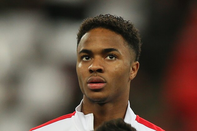 England's Raheem Sterling waits for the national anthems to begin during the international friendly soccer match between England and Denmark at Wembley stadium in London Wednesday, March 5, 2014. (AP Photo/Alastair Grant)