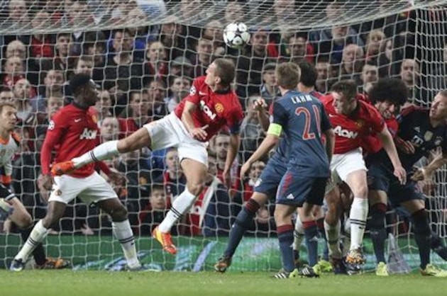 Manchester United's Nemanja Vidic, center, scores the opening goal during the Champions League quarterfinal first leg soccer match between Manchester United and Bayern Munich at Old Trafford Stadium, Manchester, England, Tuesday, April 1, 2014.(AP Photo/Jon Super) Manchester United's Nemanja Vidic, center, scores the opening goal during the Champions League quarterfinal first leg soccer match between Manchester United and Bayern Munich at Old Trafford Stadium, Manchester, England, Tuesday, April 1, 2014.(AP Photo/Jon Super)