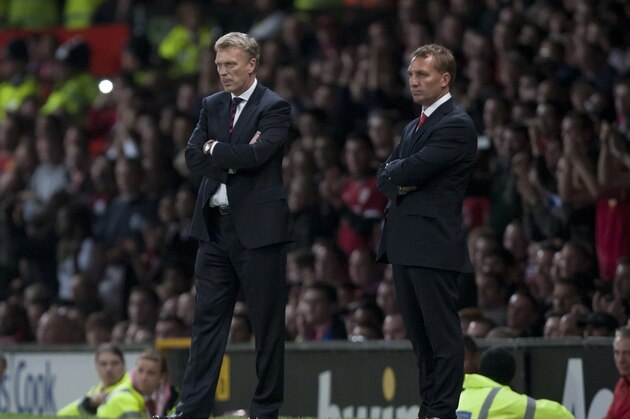 Manchester United's manager David Moyes, left, stands alongside Liverpool's manager Brendan Rodgers during their English League Cup soccer match at Old Trafford Stadium, Manchester, England, Wednesday Sept. 25, 2013. (AP Photo/Jon Super)