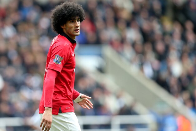 Manchester United's Maroune Fellaini during their English Premier League soccer match against Newcastle United at St James' Park, Newcastle, England, Saturday, April 5, 2014. (AP Photo/Scott Heppell)