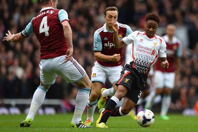 LONDON, ENGLAND - APRIL 06:  Raheem Sterling of Liverpool is challenged by Kevin Nolan of West Ham during the Barclays Premier League match between West Ham United and Liverpool at Boleyn Ground on April 6, 2014 in London, England.  (Photo by Mike Hewitt/Getty Images)