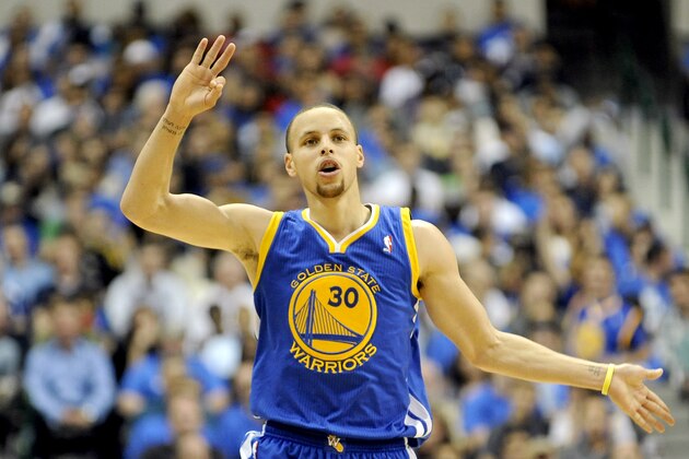 Golden State Warriors guard Stephen Curry (30) runs downcourt after making a shot in the second half of an NBA basketball game against the Dallas Mavericks, Tuesday, April 1, 2014, in Dallas. Golden State won 122-120 in overtime. (AP Photo/Matt Strasen)