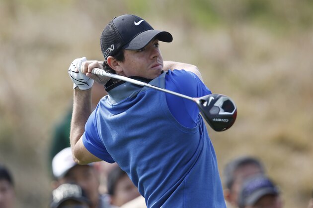 Rory McIlroy of Northern Ireland tees off on the 8th hole during the 3rd round of the BMW Masters golf tournament at the Lake Malaren Golf Club in Shanghai, China, Saturday, Oct. 26, 2013. (AP Photo/Eugene Hoshiko)