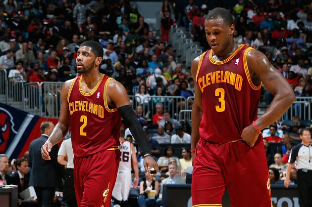 ATLANTA, GA - APRIL 04:  Kyrie Irving #2 and Dion Waiters #3 of the Cleveland Cavaliers walk off the court between free throws in their 117-98 loss to the Atlanta Hawks at Philips Arena on April 4, 2014 in Atlanta, Georgia.  NOTE TO USER: User expressly acknowledges and agrees that, by downloading and or using this photograph, User is consenting to the terms and conditions of the Getty Images License Agreement.  (Photo by Kevin C. Cox/Getty Images)
