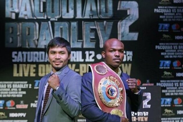 Boxer Manny Pacquiao, of the Phillipines, left, poses for a photo with Timothy Bradley of Indio, Ca., the current WBO World Welterweight champion, during a press conference,Thursday, Feb. 6, 2014, in New York.  The pair will face off in a rematch April 12, 2014, in Las Vegas. Bradley won their first encounter. (AP Photo/Kathy Willens)