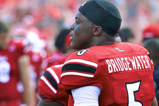 Louisville quarterback Teddy Bridgewater (5) looks for a receiver against South Florida during the first quarter of an NCAA college football game Saturday, Oct. 26, 2013, in Tampa, Fla. (AP Photo/Chris O'Meara)