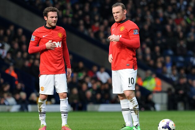 Manchester United's Juan Mata, left, and Wayne Rooney during the English Premier League soccer match between West Bromwich Albion and Manchester United at The Hawthorns Stadium in West Bromwich, England, Saturday, March 8, 2014.  (AP Photo/Rui Vieira)