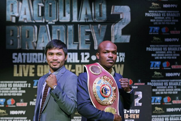 Boxer Manny Pacquiao, of the Phillipines, left, poses for a photo with Timothy Bradley of Indio, Ca., the current WBO World Welterweight champion, during a press conference,Thursday, Feb. 6, 2014, in New York.  The pair will face off in a rematch April 12, 2014, in Las Vegas. Bradley won their first encounter. (AP Photo/Kathy Willens)