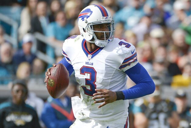 Buffalo Bills quarterback EJ Manuel looks for a receiver during the first half of an NFL football game against the Jacksonville Jaguars in Jacksonville, Fla., Sunday, Dec. 15, 2013.(AP Photo/Phelan M. Ebenhack)