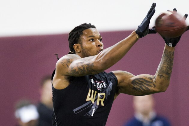 Kelvin Benjamin catches a pass during pro day in front of NFL football scouts at Florida State University on Tuesday, March 18, 2014, in Tallahassee, Fla. (AP Photo/Colin Hackley)