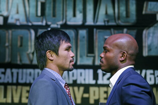 Boxer Manny Pacquiao, of the Phillipines, left, stares down upcoming opponent Timothy Bradley of Indio, Ca., current WBO World Welterweight champion, during a press conference,Thursday, Feb. 6, 2014, in New York.  The pair will face off in a rematch, a WBO World Welterweight title fight April 12, 2014, in Las Vegas.  Bradely won their first encounter. (AP Photo/Kathy Willens)