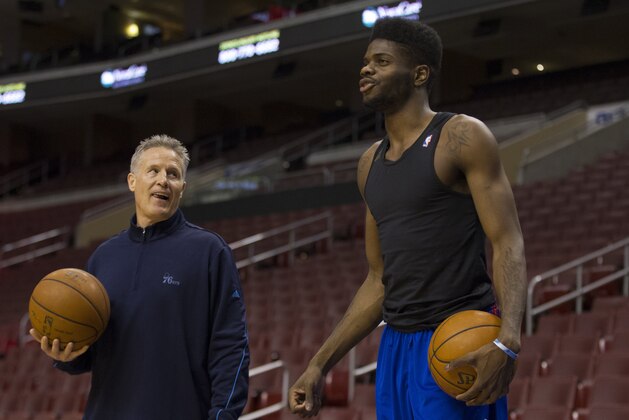 Philadelphia 76ers' head coach Brett Brown, left, works with Nerlens Noel, right, prior to the first half of an NBA basketball game against the Portland Trail Blazers, Saturday, Dec. 14, 2013, in Philadelphia.  (AP Photo/Chris Szagola)