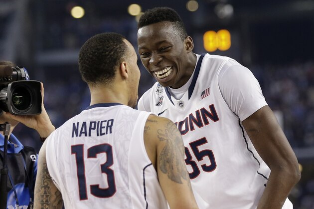 Connecticut guard Shabazz Napier (13) and center Amida Brimah (35) celebrate after beating Kentucky 60-54 at the NCAA Final Four tournament college basketball championship game Monday, April 7, 2014, in Arlington, Texas. (AP Photo/Eric Gay) Connecticut guard Shabazz Napier (13) and center Amida Brimah (35) celebrate after beating Kentucky 60-54 at the NCAA Final Four tournament college basketball championship game Monday, April 7, 2014, in Arlington, Texas. (AP Photo/Eric Gay)