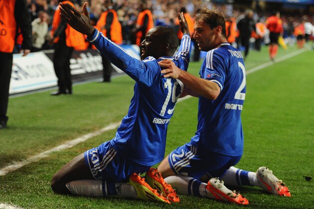 LONDON, ENGLAND - APRIL 08:  Demba Ba of Chelsea celebrates scoring their second goal with Branislav Ivanovic of Chelsea  during the UEFA Champions League Quarter Final second leg match between Chelsea and Paris Saint-Germain FC at Stamford Bridge on April 8, 2014 in London, England.  (Photo by Mike Hewitt/Getty Images)