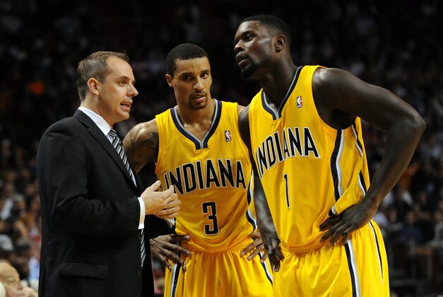 Dec 18, 2013; Miami, FL, USA; Indiana Pacers head coach Frank Vogel (left) talks with point guard George Hill (3) and shooting guard Lance Stephenson (1) during the second half against the Miami Heat at American Airlines Arena. Miami won 97-94. Mandatory Credit: Steve Mitchell-USA TODAY Sports