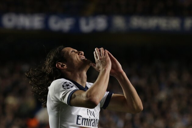 Paris Saint-Germain's Edinson Cavani reacts after missing a chance to score a goal during the Champions League quarterfinal second leg soccer match between Chelsea and Paris Saint Germain at Stamford Bridge stadium in London, Tuesday, April 8, 2014. Chelsea advance to the semifinals. (AP Photo/Matt Dunham).
