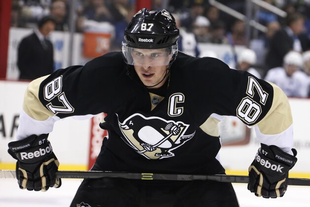 Pittsburgh Penguins' Sidney Crosby (87) prepares to take a face off during an NHL hockey game between the Pittsburgh Penguins and the Tampa Bay Lightning in Pittsburgh, Saturday, March 22, 2014. (AP Photo/Gene J. Puskar)