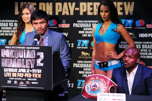 NEW YORK, NY - FEBRUARY 06: Manny Pacquiao addresses the media, while Timothy Bradley (R) looks on, during the press conference to promote his upcoming WBO welterweight championship rematch fight against Timothy Bradley at New World Stages on February 6, 2014 in New York City.  (Photo by Maddie Meyer/Getty Images)