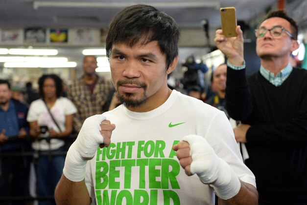 Apr 2, 2014; Hollywood, CA, USA; Manny Pacquiao sets a boxing pose before starting his workout at Wild Card Boxing Club. Mandatory Credit: Jayne Kamin-Oncea-USA TODAY Sports Apr 2, 2014; Hollywood, CA, USA; Manny Pacquiao sets a boxing pose before starting his workout at Wild Card Boxing Club. Mandatory Credit: Jayne Kamin-Oncea-USA TODAY Sports