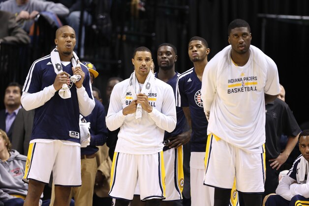 Nov 11, 2013; Indianapolis, IN, USA; Indiana Pacers from left to right forward David West, guard George Hill, guard Lance Stephenson, forward Paul George, and center Roy Hibbert watch the Pacers extend their winning streak to 8-0 against the Memphis Grizzlies at Bankers Life Fieldhouse. Indiana defeats Memphis 95-79. Mandatory Credit: Brian Spurlock-USA TODAY Sports
