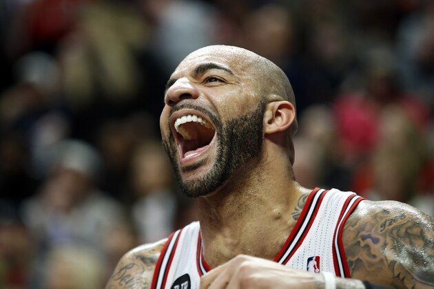 Chicago Bulls forward Carlos Boozer smiles during a timeout in the second half of an NBA basketball game against the Milwaukee Bucks in Chicago, Friday, April 4, 2014. The Bulls won 102-90. (AP Photo/Kamil Krzaczynski) Chicago Bulls forward Carlos Boozer smiles during a timeout in the second half of an NBA basketball game against the Milwaukee Bucks in Chicago, Friday, April 4, 2014. The Bulls won 102-90. (AP Photo/Kamil Krzaczynski)