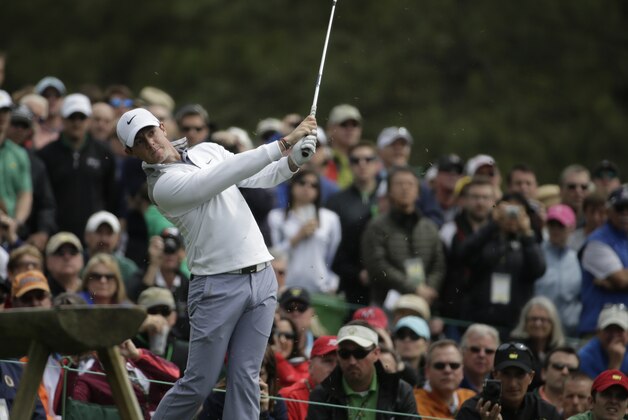 Rory McIlroy, of Northern Ireland, watches his tee shot on the 12th hole during a practice round for the Masters golf tournament Tuesday, April 8, 2014, in Augusta, Ga. (AP Photo/Chris Carlson)