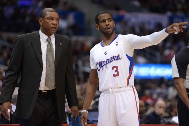 Apr 3, 2014; Los Angeles, CA, USA;   Los Angeles Clippers head coach Doc Rivers talks with guard Chris Paul (3) during the first half of the game against the Dallas Mavericks at Staples Center. Mandatory Credit: Jayne Kamin-Oncea-USA TODAY Sports