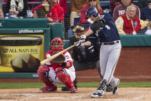 Milwaukee Brewers' Ryan Braun hits a solo home run in front of Philadelphia Phillies catcher Carlos Ruiz (51) during the fourth inning of a baseball game, Tuesday, April 8, 2014, in Philadelphia. (AP Photo/Chris Szagola)
