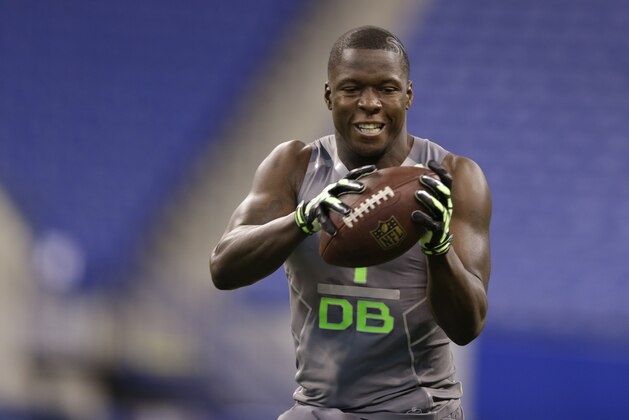 Utah State defensive back Maurice Alexander runs a drill at the NFL football scouting combine in Indianapolis, Tuesday, Feb. 25, 2014. (AP Photo/Michael Conroy)